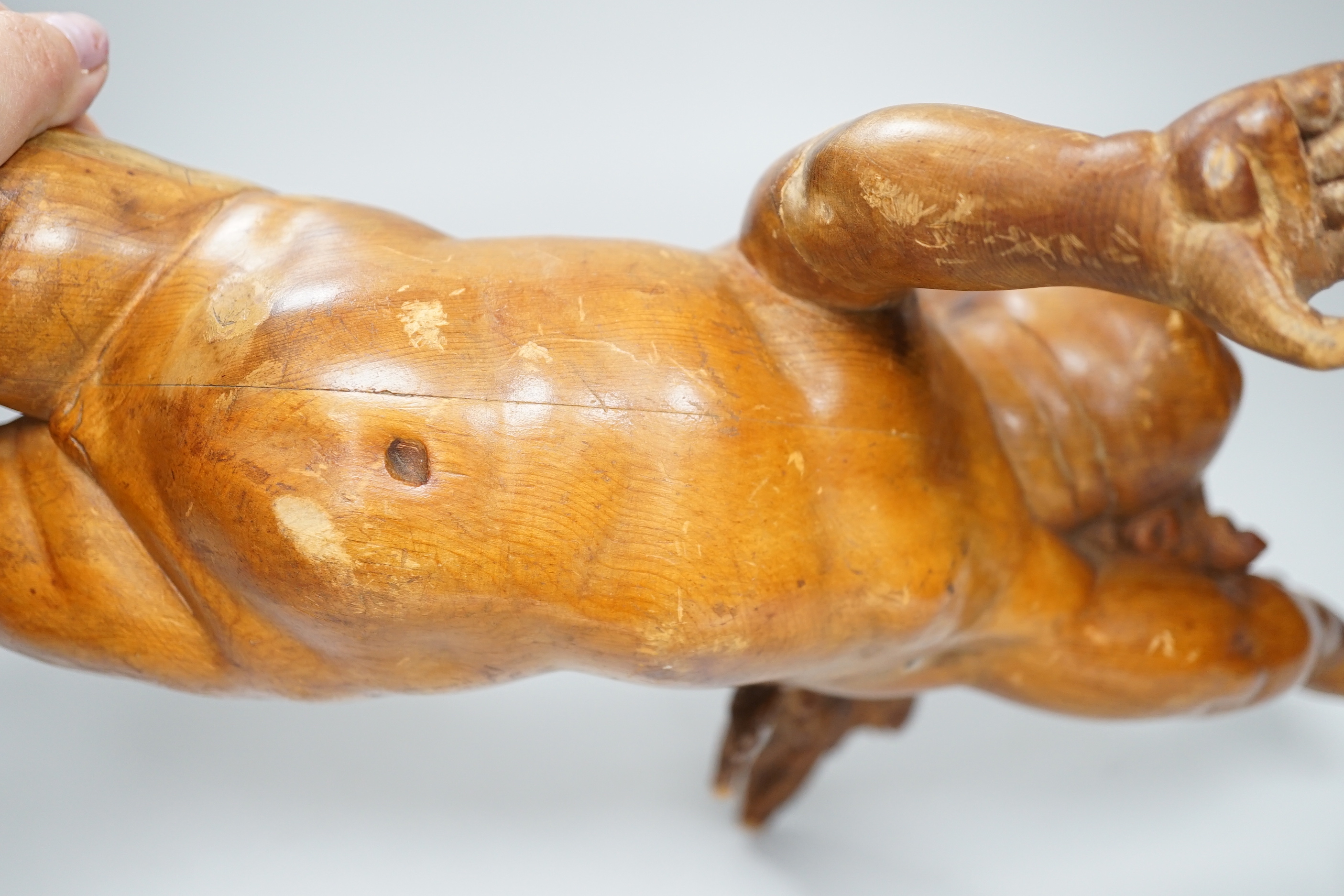A carved pine cherub, 40cm (a.f.)